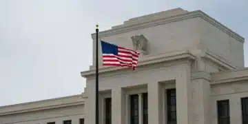 Federal Reserve building with US flag, symbolizing economic stability and monetary policy decisions.