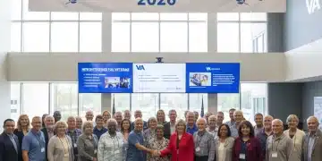 Veterans engaging with VA representatives, highlighting new programs for 2026